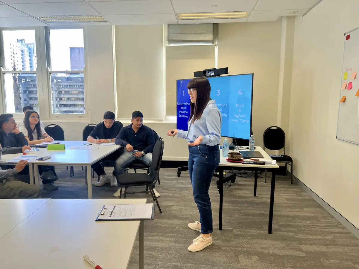 A facilitator presenting at a My Financial Future college workshop