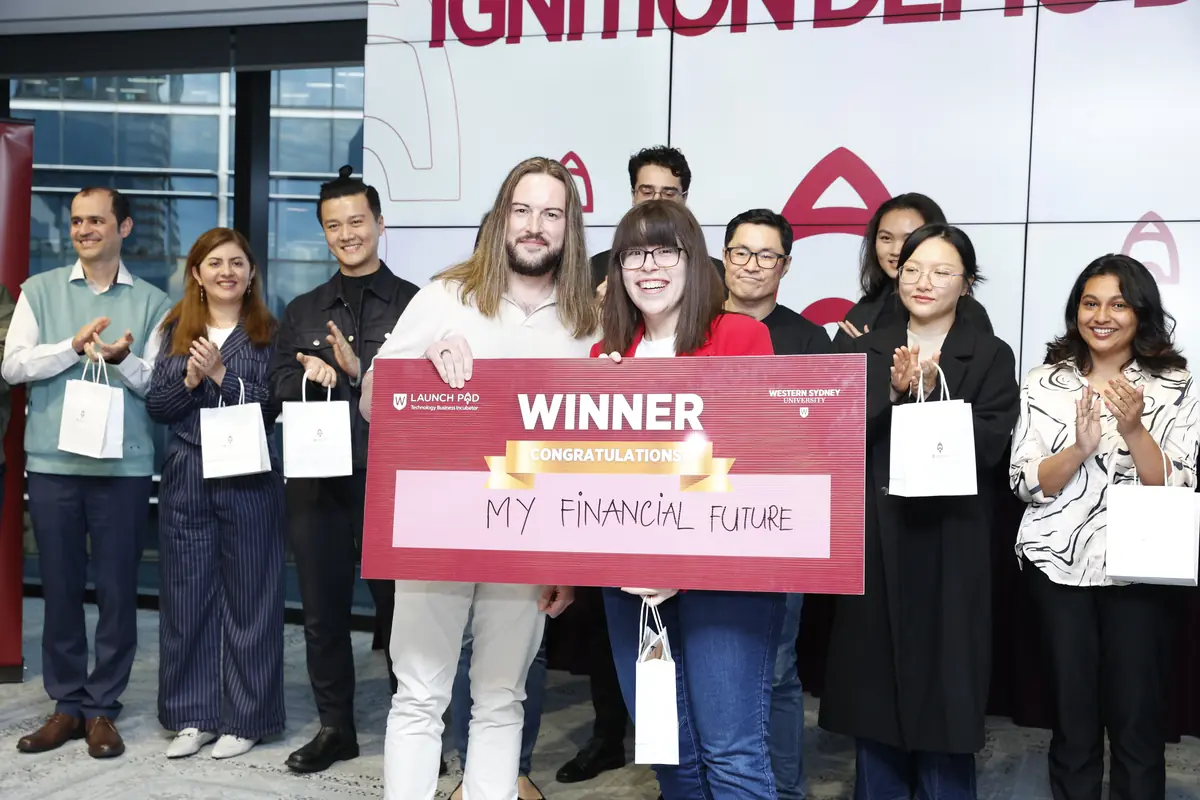 Students celebrating a win at a My Financial Future pitch day